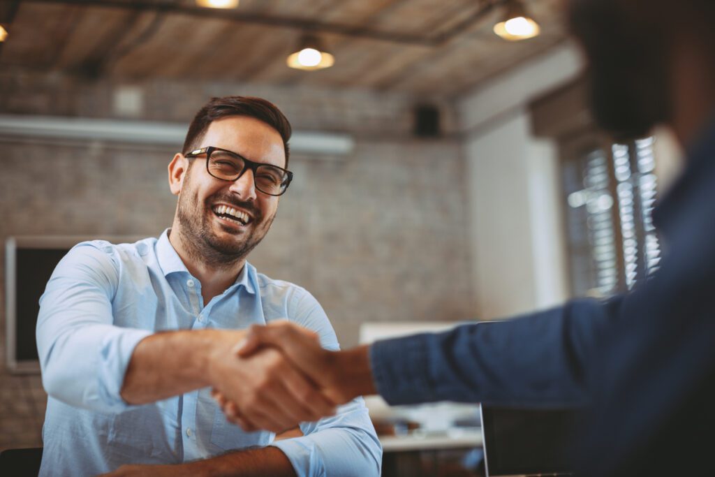 Close up of handshake in the office